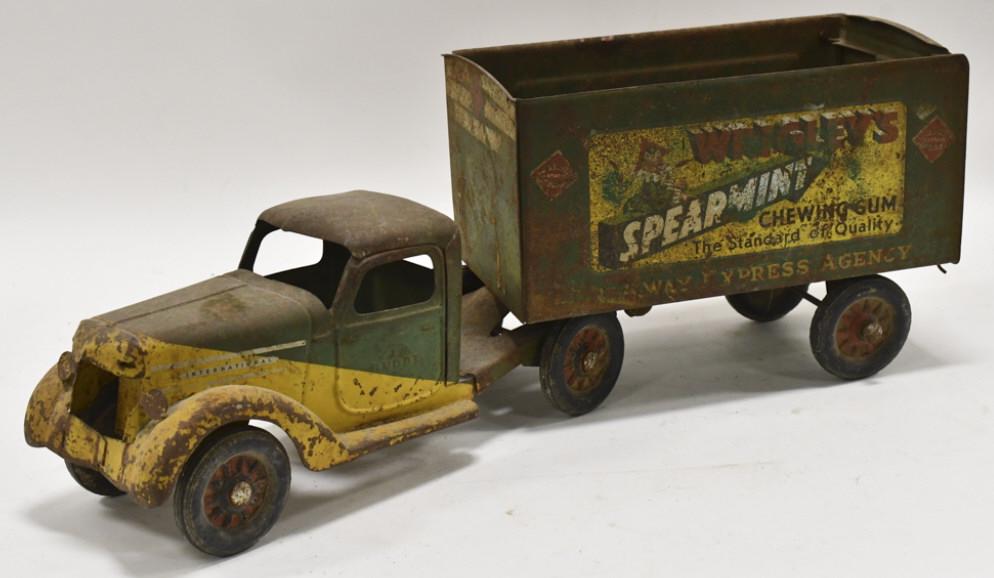 Buddy L Wrigley's Spearmint Chewing Gum Truck: Original Buddy L Wrigley's Spearmint Chewing Gum truck and trailer. The truck is missing the grill and the trailer is missing the roof. The truck has surface rust, paint loss, and wear from play and a