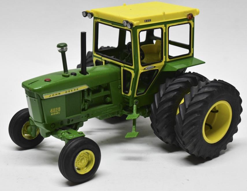 Custom 1/16 John Deere 4020 Tractor w/ Hiniker Cab: Custom 1/16 scale John Deere 4020 tractor with hiniker cab. Displays well with 3 point and custom Goodyear tires. Good condition with light display wear.