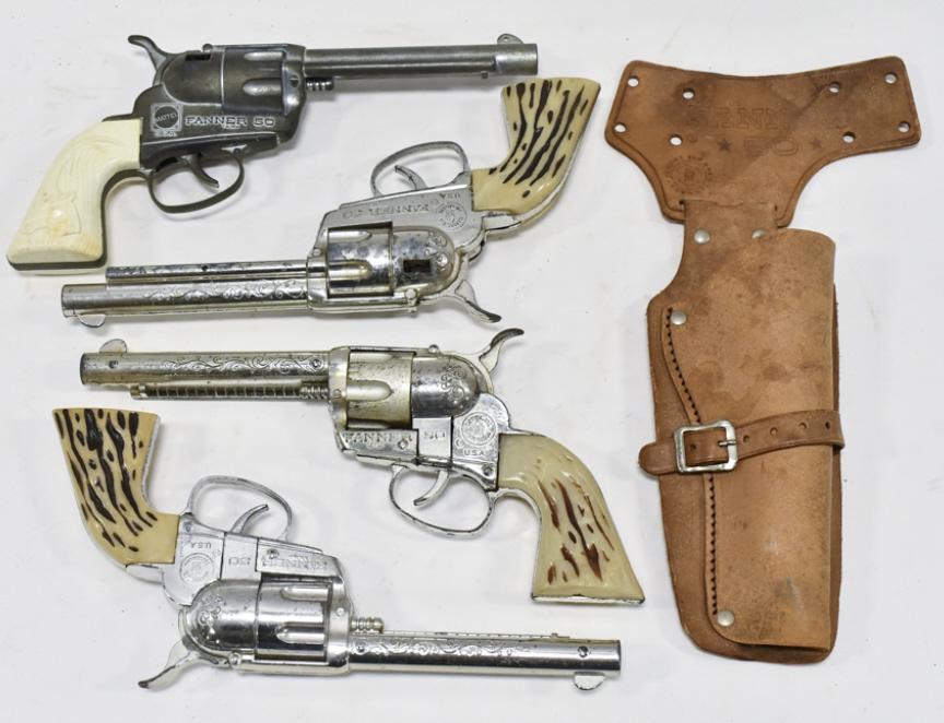 (4) Mattel Fanner 50 Cap Guns & (1) Holster: Lot of (4) Mattel Fanner 50 cap guns and (1) Fanner 50 holster. The guns have corrosion and wear from use and age. Each gun measures approximately 10 long.