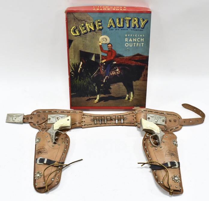 Leslie Henry Gene Autry Cap Gun Set w/ Holster: Leslie Henry Gene Autry cap gun set with Gene Autry leather holster in the box. The guns have some corrosion and wear from use and age. The holster has some cracking and wear from age. The box has som