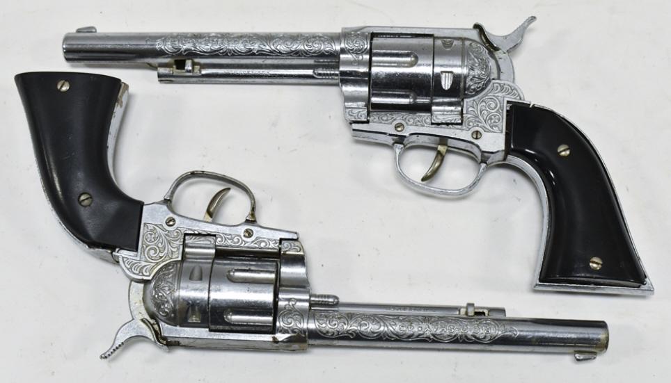 (2) Hubley Ric-O-Shay 45 Cap Gun Pistols: (2) Hubley Ric-O-Shay 45 cap gun pistols. Both of the guns have corrosion and wear from use and age. Each gun measures approximately 11-1/2" long.