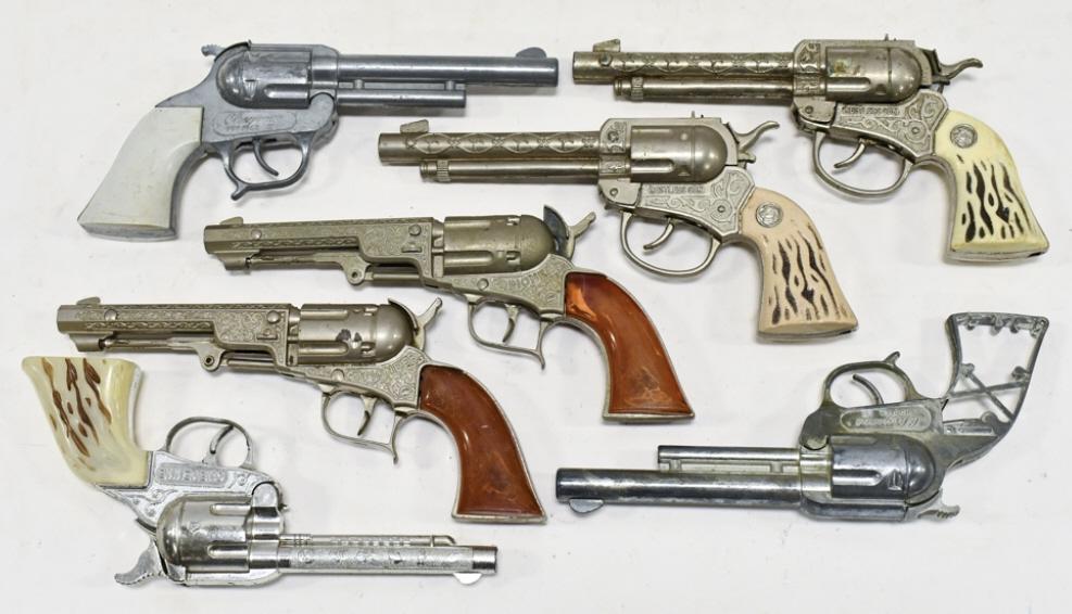 Lot Of Pioneer, Cheyenne, & Restless Cap Guns: Lot includes (2) Pioneer, (3) Cheyenne, and (2) Restless cap gun pistols. The one cap gun is missing the grips. All have wear from use and age. Largest measures approximately 9-1/2" long.