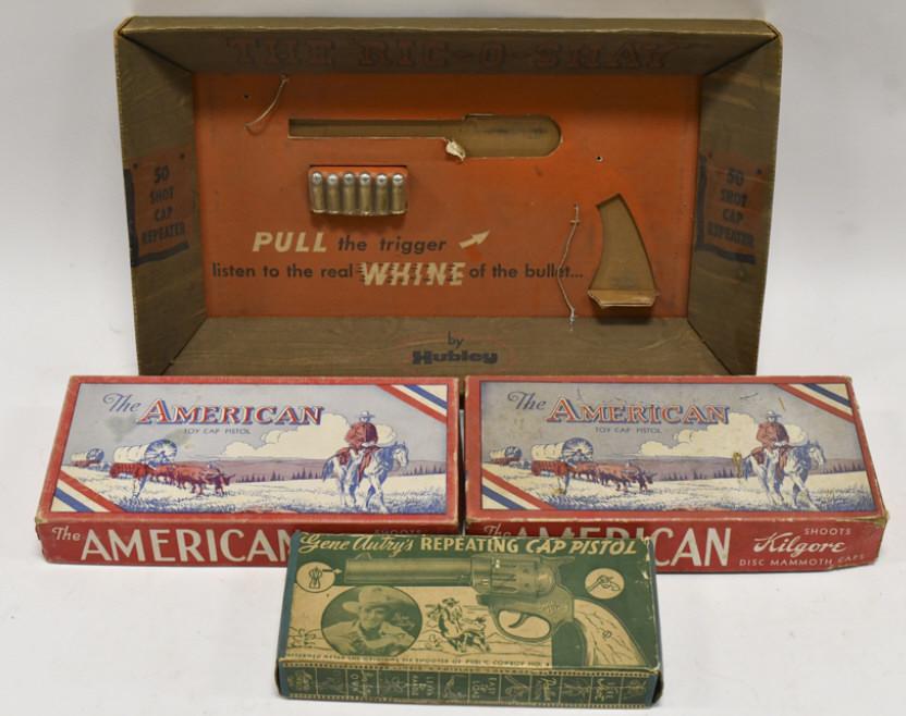 Empty Boxes For Ric-O-Shay, Gene Autry Cap Guns: Empty boxes for The Ric-O-Shay, American toy cap pistol, and Gene Autry repeating cap pistol. The boxes have wear from use and age.