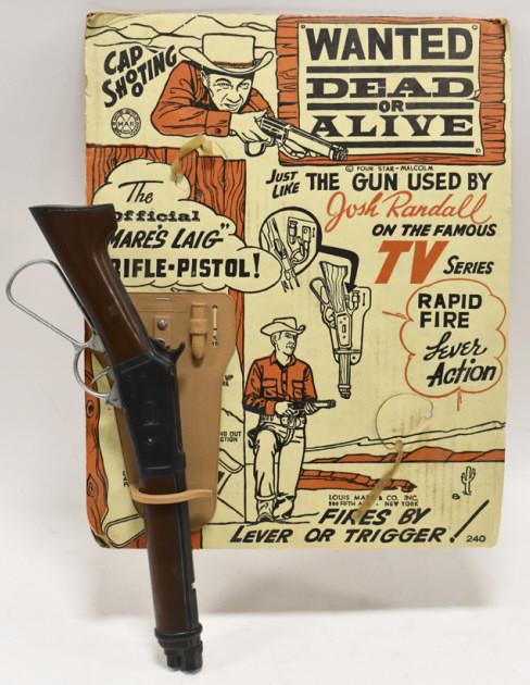 Marx Josh Randall Wanted Dead Or Alive Cap Gun: Marx Official "Mare's Laig" Josh Ranal rifle-pistol with the original package. The package has wear from use and age. The gun measures approximately 17" long.
