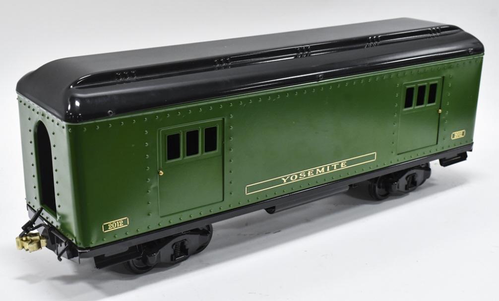 T-Reproductions Buddy L Yosemite Baggage Car: T-Reproductions Buddy L Yosemite #2012 Baggage car. Good condition with a couple scuffs and storag wear. The doors slide open. Measures approximately 26" long.