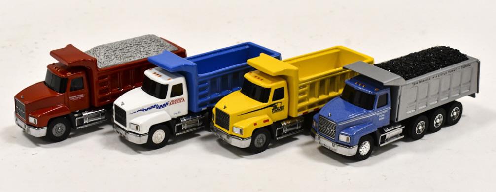 (4) 1/64 Penjoy Mack Dump Trucks: Lot of (4) 1/64 scale Penjoy Mack dump trucks. Good condition with light display wear.