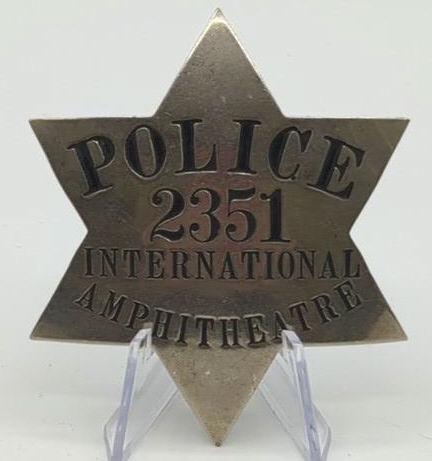 Obsolete International Ampitheatre Police Badge: 3.25" 6-pt Pie Plate Badge. Marked C.H. Hanson on the back side.