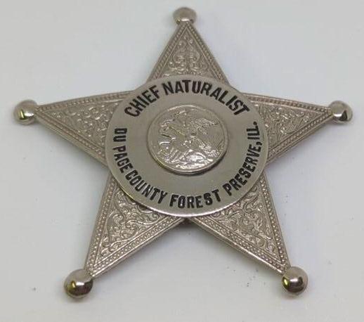 Obsolete Du Page Co Forest Preserve Specialist Bdg: 2.25" 5pt star badge, engraved "Robert M Kelly" on back.