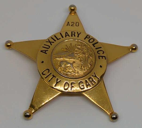 Obsolete City of Gary Auxiliary Police Badge #A20: 3." 5pt goldtone star badge