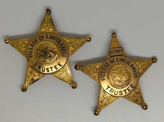 Pair of Obsolete Village of Lincolnwood Trustee Bg: 2-1/8" gold tone 5pt star badges. One for Trustee, one for Trustee-Retired