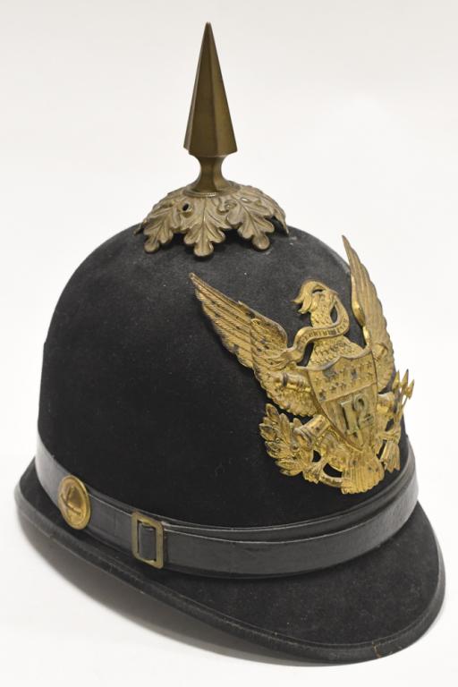 Spanish-American War M1890 Infantry Helmet: Spanish-American War model 1890 army infantry spiked dress helmet. Appears to be in good condition with toning to brass insignias and accents, cracking and wear to leather accents, and other wear from