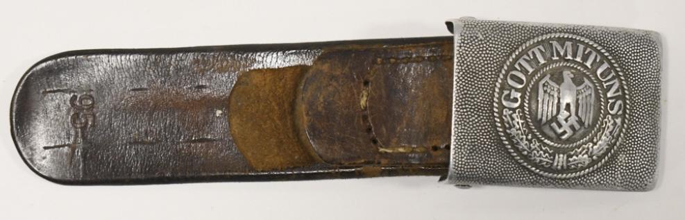 WWII German Army / Heer Enlisted Man's Belt Buckle: WWII German Army (Heer) Enlisted Man's dress belt buckle with leather tab. Buckle has wear from use and age . Back is marked. Buckle measures approximately 2-1/2" across by 1-7/8" tall