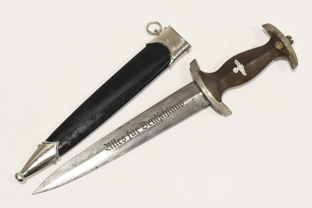 WWII German NSKK Dagger With Scabbard: WWII German NSKK Dagger with scabbard. Dagger blade is marked "RZM M7/80". Blade has " Uillis Fur Deutschland" engraved down it. Appears to be in overall fair condition with plate loss, pitting on bla