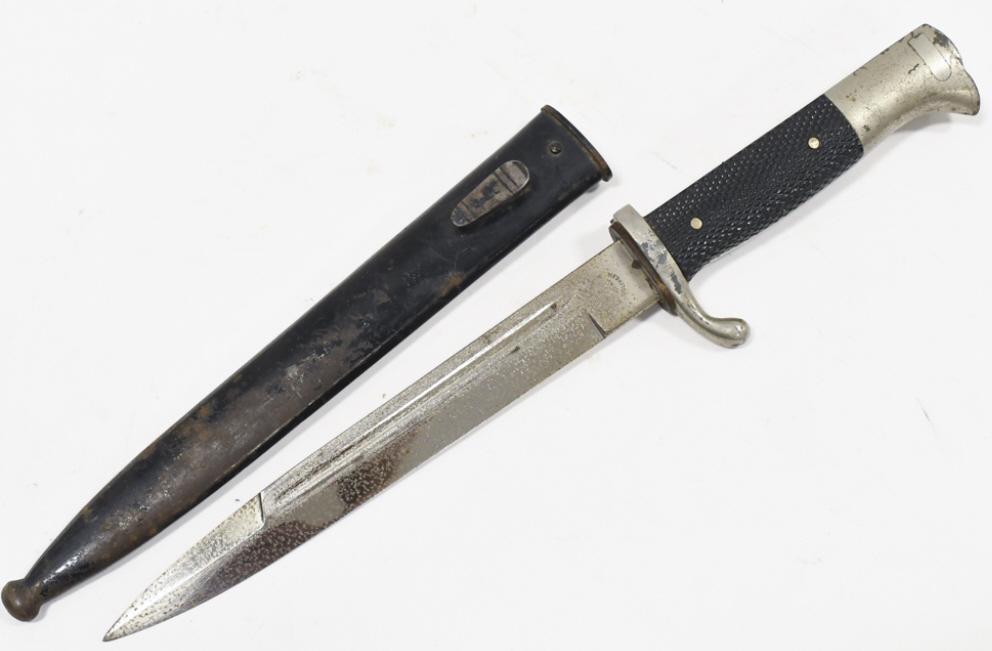 WWII German Dress Bayonet w/ Scabbard: WWII German dress bayonet with scabbard. Worn condition with plate loss, pitting, and wear from use and age. Blade is marked "Robert Klaas". Overall with scabbard it measures approximately 14" across.