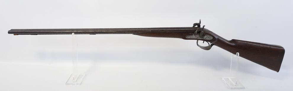 William Moore & Co. .28 Ga. Side By Side Shotgun: Circa 1860 English William Moore & Co. side x side percussion shotgun in .28 gauge. The shotgun has 33" barrels and is in fair used condition with wear. The tang was cracked, the toe of the buttstock