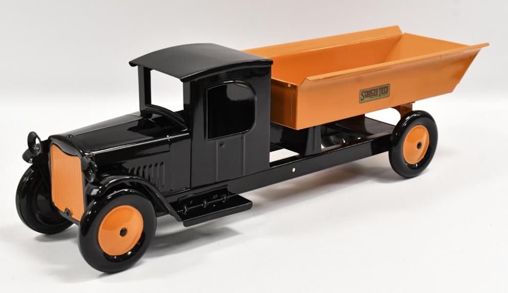 Restored Structo Dump Truck: Restored Structo dump truck. This is the headlight version, but it is missing the headlights and the crank for the dump. Displays well with a nice restoration. Measures approximately 23" long.