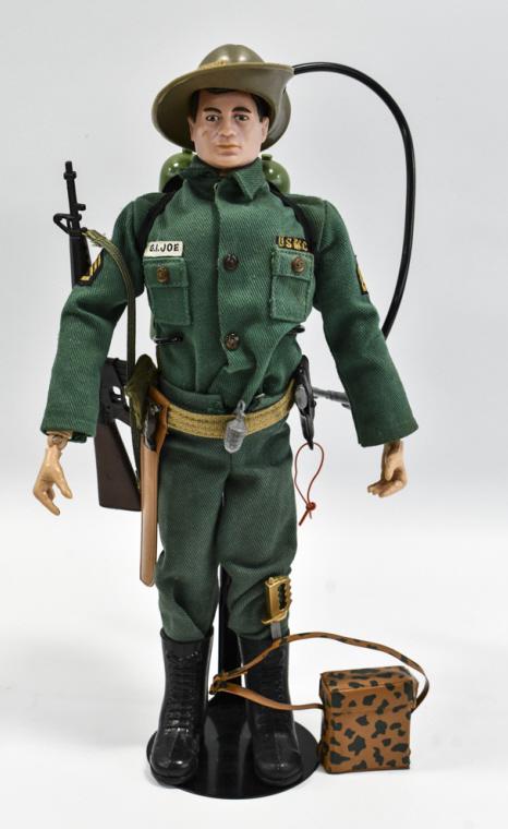 Vintage Hasbro GI Joe Marine Jungle Fighter: Hard to find vintage Hasbro GI Joe Marine Jungle Fighter action figure. Comes with field telephone, rifle, handgun, and other accessories. The figure has the usual stress cracks and play wear.