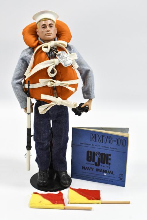 Vintage Hasbro GI Joe Sailor w/ Navy Attack Set: Vintage Hasbro GI Joe sailor with Navy attack set. Includes rifle, flags, binoculars, navy manual, and life preserver. The figure has the usual stress cracks and play wear.