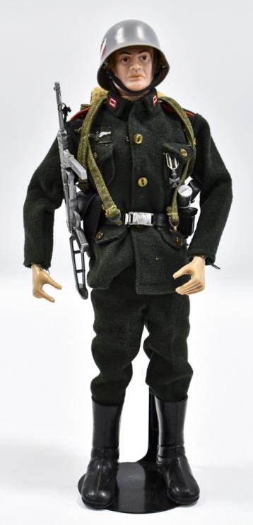 Vintage Hasbro GI Joe German Soldier w Accessories: Vitnage Hasbro GI Joe German Soldier with accessories. The figure comes with ffield pack, grenades, medal, luger pistol, machine pistol, and outfit. The figure has the usual stress cracks and wear fro