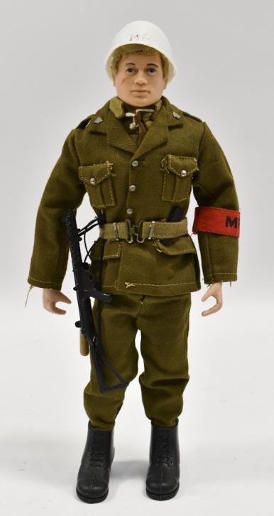 Vintage Hasbro GI Joe Military Police Figure: Vintage Hasbro GI Joe / action man military police figure. The figure has the red "MP" arm band, baton, gun, and helmet. Good condition with some stress cracks and wear from play and age. The figure i