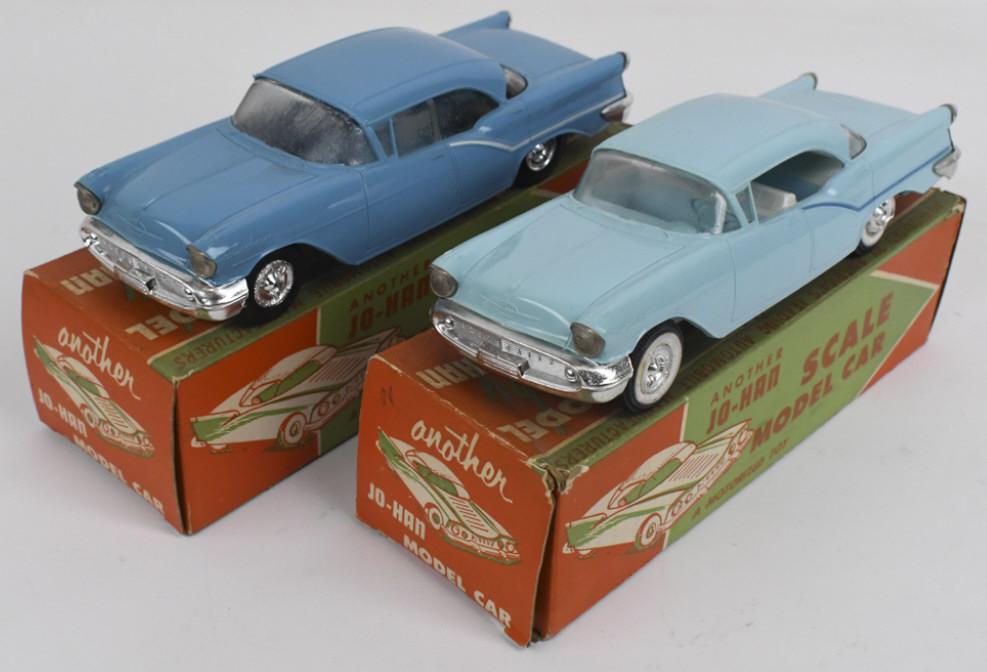 2) 1957 Oldsmobile Ninety Eight Dealer Promo Cars: Lot of two 1:25 scale original 1957 Oldsmobile Ninety Eight dealer friction promo cars in original boxes by Jo-Han. Cars vary in condition with some discoloration / spotting, expected warping, and wea