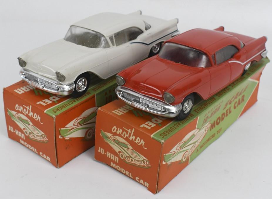 2) 1957 Oldsmobile Ninety Eight Dealer Promo Cars: Lot of two 1:25 scale original 1957 Oldsmobile Ninety Eight dealer friction promo cars in original boxes by Jo-Han. Both cars appear to be in nice condition with some light discoloration / spotting, l