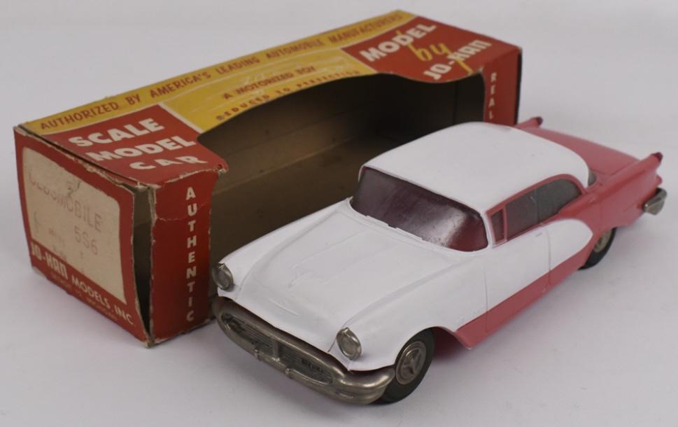 1956 Oldsmobile Holiday Dealer Promo Car w Box: 1:25 scale original 1956 Oldsmobile Holiday dealer friction promo car in original box by Jo-Han. Car appears to be in nice condition with some discoloration, expected warping, and wear from age and st