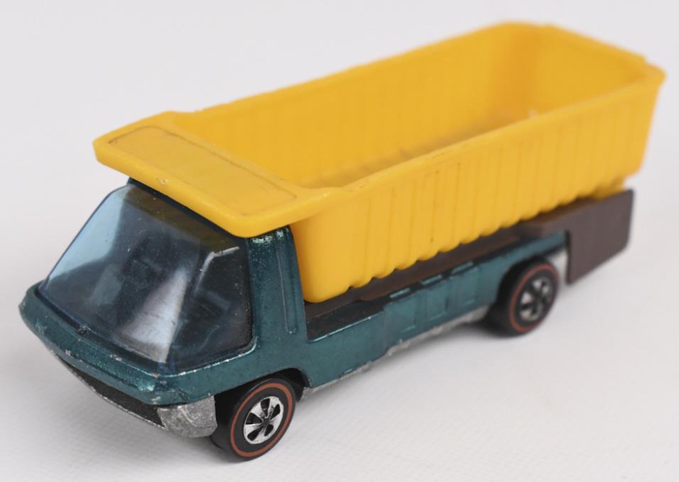 Hot Wheels Redlines Dumptruck: Hot Wheels Redline aqua Dumptruck. It appears to be in excellent condition with just a bit of high edge wear in spots, excellent wheels and glass, and base is clean.