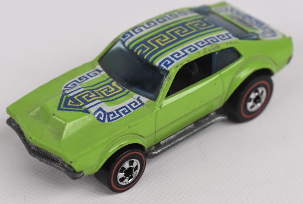 Hot Wheels Redline Flying Colors Mighty Maverick: Hot Wheels Redlines Flying Colors Green Mighty Maverick. Appears to be in excellent to near mint condition, It does have some factory casting roughness at both roof side edges. It features fantastic w
