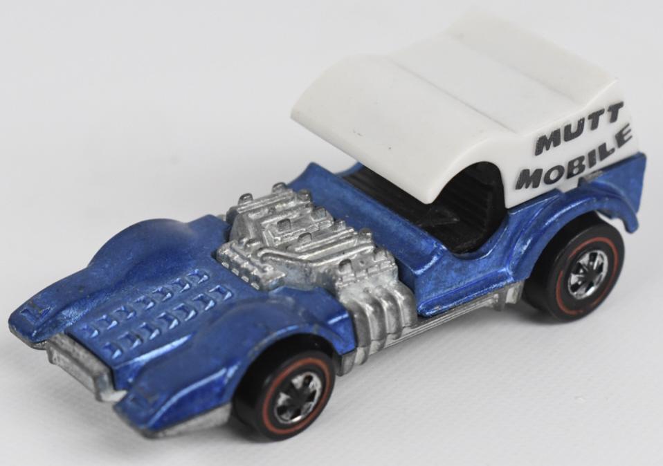 Hot Wheels Redline Blue Mutt Mobile: Hot Wheels Redline Blue Mutt Mobile. It appears to be in excellent to near mint condition with a few tiny micros. It features an excellent top with dogs, fantastic wheels, and base.