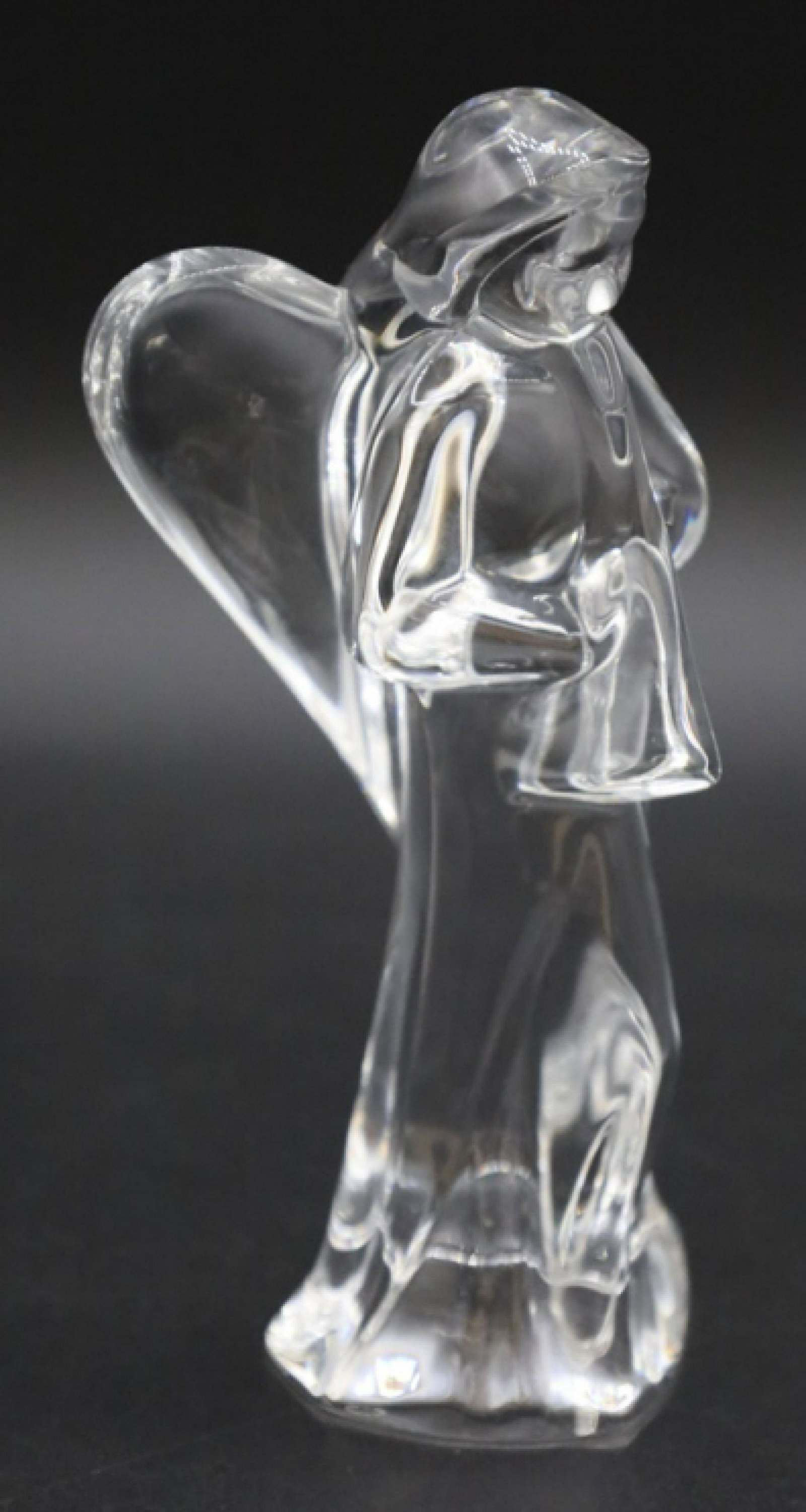 Baccarat Crystal Angel Figurine: French Baccarat crystal angel figurine. The angel is in great condition with no chips or cracks, acid marked. Measure 6" tall x 2-1/2" across.