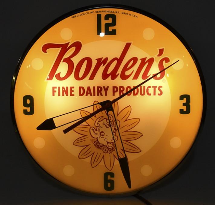 Bordens Dairy Lighted Pam Style Contemporary Clock: Borden's Dairy Products lighted PAM style contemporary advertising clock. Clock features an outer glass bubble, metal can, and reverse on glass face. Clock appears to be in overall good condition with