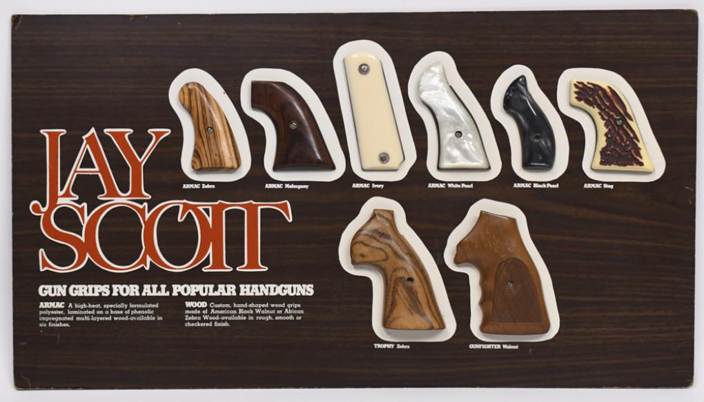 Vintage Jay Scott Pistol / Handgun Grips Display: Unique vintage single sided masonite Jay Scott Handgun grips advertising store display with eight original Jay Scott grip halves. Display appears to be in overall nice condition with some worn corners
