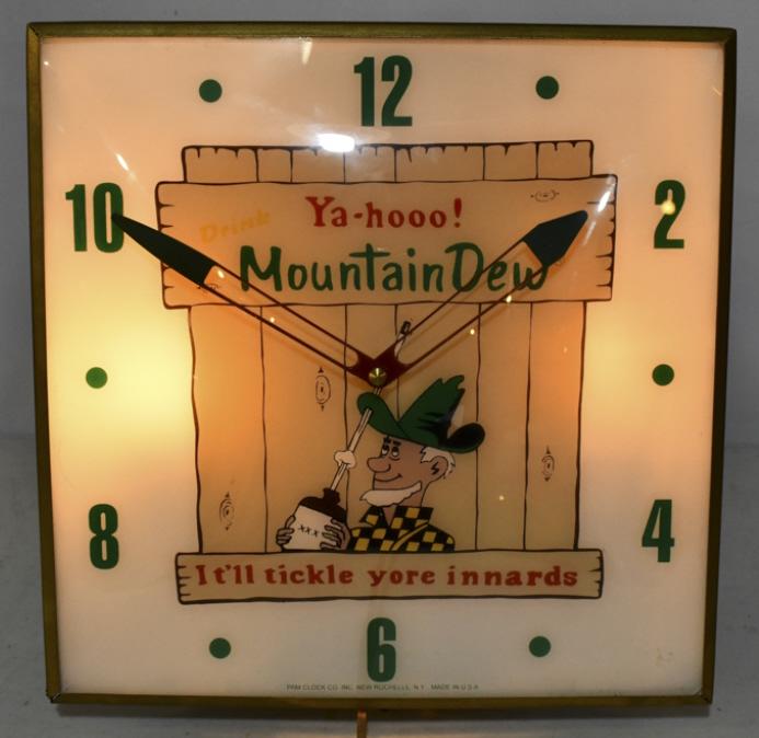 Mountain Dew Lighted Advertising PAM Clock: Mountain Dew Soda lighted advertising PAM clock. Clock features an outer glass bubble, original vintage PAM metal can, and modern reverse on glass face. Clock appears to be in overall good condition w