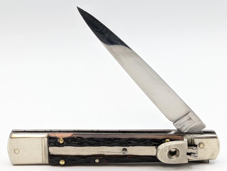 Solingen Germany Rostfrei Leverlock Switchblade: Solingen Germany Rostfrei Leverlock Switchblade Knife with Jigged Bone Handle. Knife is in nice condition with various scratches to blade and bolster. Knife has been sharpened. Blade length is 3.25in,