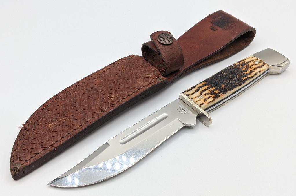 2004 Case XX Stag Handle Hunting Knife 647-5: 2004 Case XX Stag Handle Hunting Knife w/ Case XX Leather Sheath. Knife is in nice condition with some scuffs to the blade and bolster from handling. Blade length of 5-1/8in and overall length of 9-1/