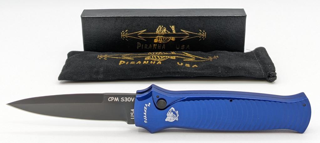 NIB Piranha Bodyguard Switchblade CPM S30V: NIB Piranha Bodyguard Switchblade CPM S30V w/ Blue Aluminum Handles. Blade length of 3-1/4in and overall length of 7-3/4in when open.