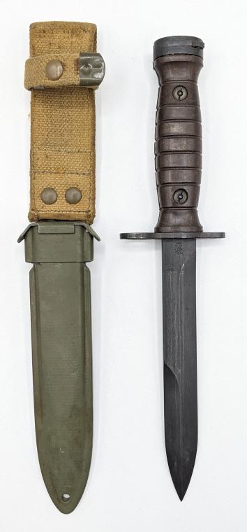 AET 1959 M1 Carbine Bayonet w/ M8A1 Scabbard: AET 1959 M1 Carbine Bayonet w/ M8A1 Scabbard. Knife is in surplus condition with stamping of maker and serial number above guard. Blade length of 6.75in and 11.5in overall.