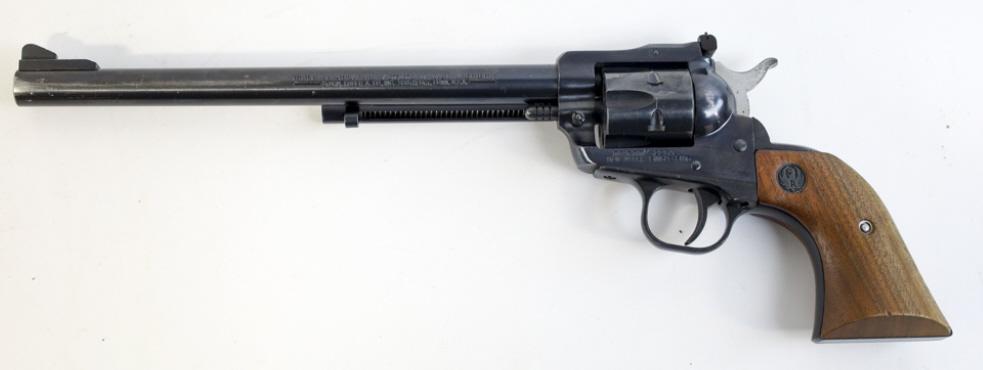 Ruger New Model Single-Six .22 Cal. Revolver: Ruger New Model Single-Six single action six-shot revolver in .22 caliber. The blued revolver is in good used condition with a chip in the right grip. The revolver has a 9-1/2" barrel and comes with a