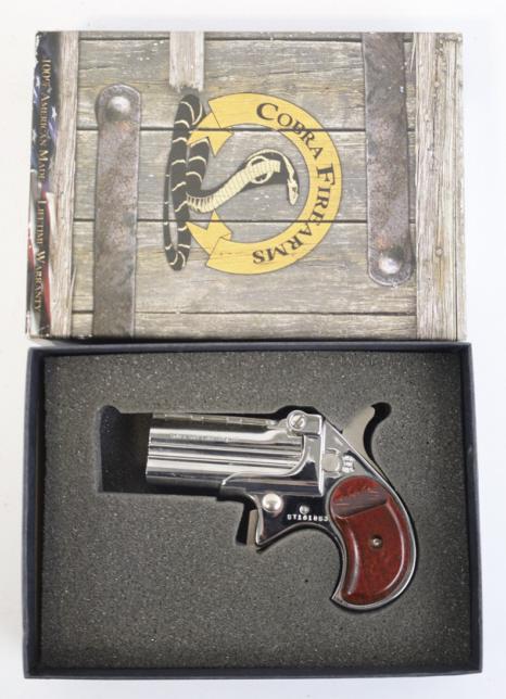 Cobra Model CB9 9mm Derringer NIB: New in box Cobra Firearms Model CB9 derringer in 9mm. The chrome finish derringer is in great condition and has a 2-3/4" barrel. Comes in the original box with rosewood grips. SN: CT181853. FFL requir