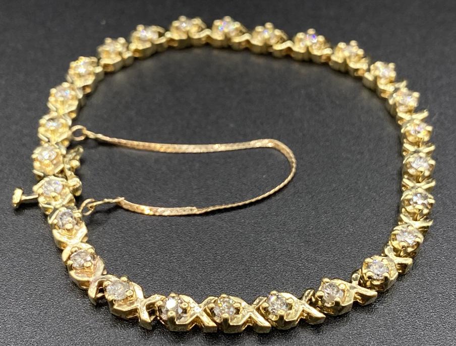 14K Yellow Gold Diamond Tennis Bracelet: Ladies 14K yellow gold and diamond tennis bracelet. Nice used condition. Bracelet length 7" Total weight 16.6 grams