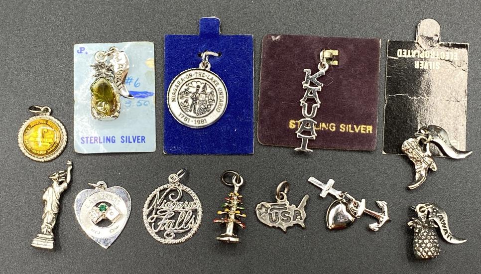 Lot of Sterling Silver Charms & Vintage Charms: Lot includes charms for charm bracelets. 12 Charms Total. includes 7 sterling charms. Total weight 30.4 grams.