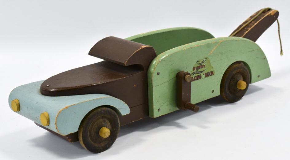 Buddy L Wood Toys Wrecking Tow Truck: Buddy L Wood Toys wrecking tow truck.. The one will has a chunk out of it. The truck has paint loss and wear from play and age. Measures approximately 18" long.