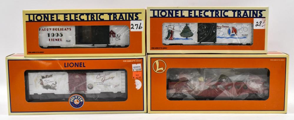 Lionel Christmas Gondola Car, & Holiday Boxcars: Lionel Christmans music boxcar #6-36881, 1996 Holiday boxcar #6-19945, Lionel Christmas boxcar 1995 #6-19938, and Christmas gondola #6-36032. Good condition in the boxes.