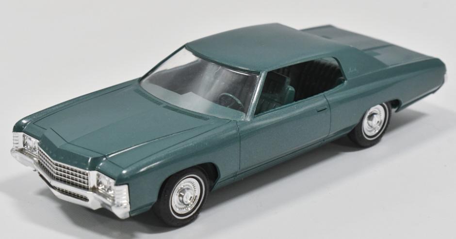 1971 Chevrolet Impala Custom Dealer Promo Car: 1971 Chevrolet Impala custom turquoise dealer promo car. The car has some scuffs and wear from age. Measures approximately 8-1/2" long.