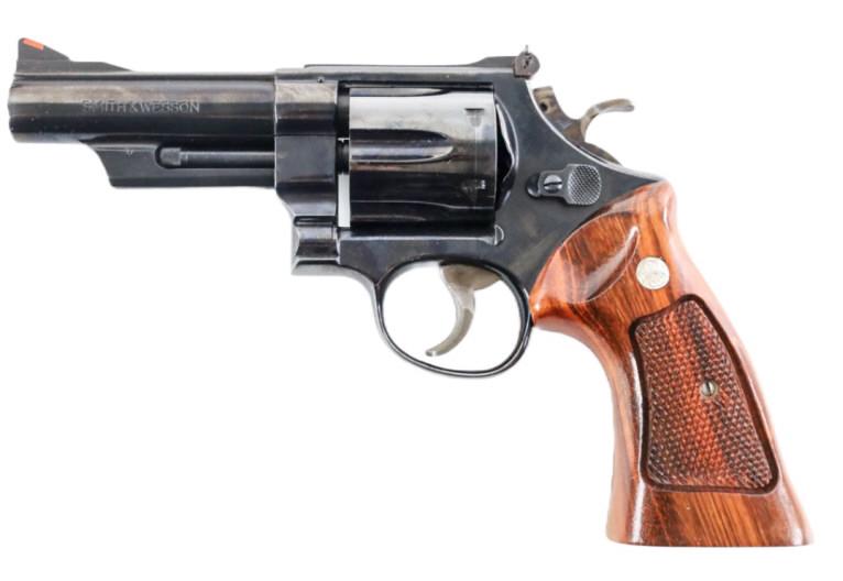 Smith & Wesson Model 57 No Dash .41 Mag. Revolver: Smith & Wesson Model 57 no dash six-shot revolver in .41 Magnum. The blue finish revolver is in like new condition in a wood display case, has a 4" barrel and target trigger/hammer. SN: N708308. Requi