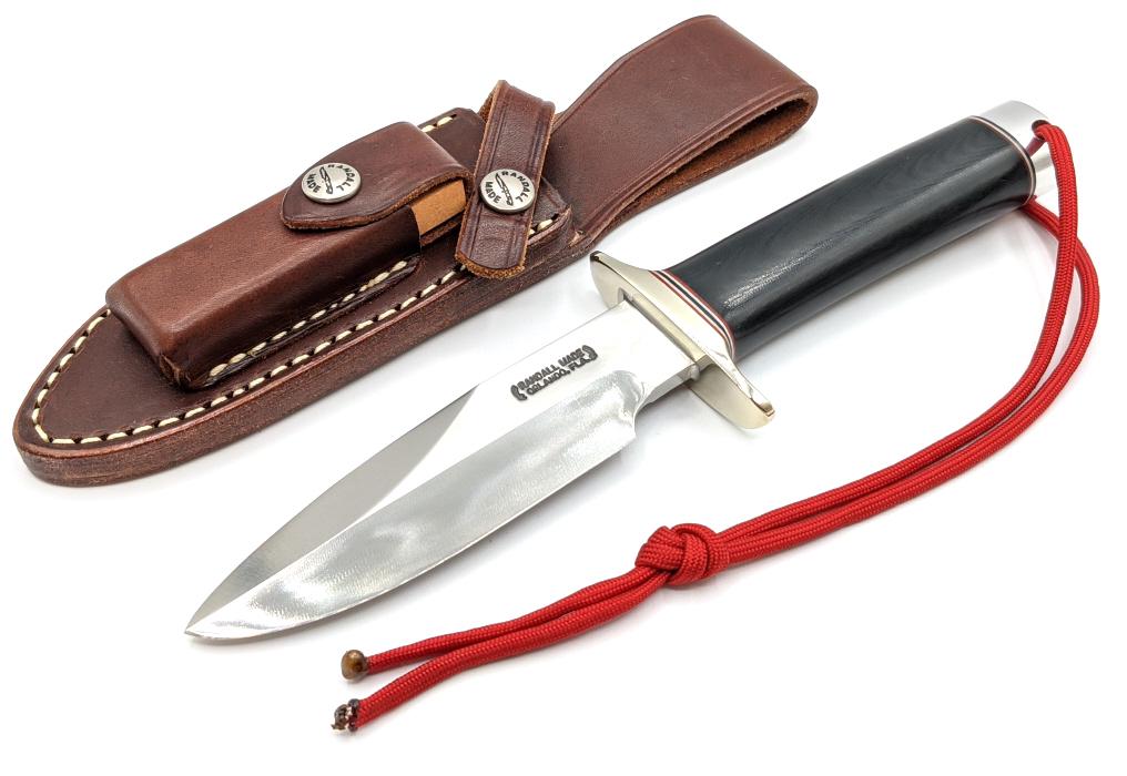 Randall Made Combat Companion w/ Randall Sheath: Randall Made Combat Companion w/ Randall Sheath. Knife comes with black micarta handle and nickel guard and butt cap. Knife is in like new condition. Blade length of 5in and overall length of 9-5/8in.