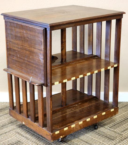 Vintage Wood Revolving Library Cart, Book Case: Vintage Wood Revolving Library Cart, Book Case with celluloid number tags from 1-35. Revolving Bookcase is in nice condition for age with little wear. Measures 34" tall 27" across 22" deep