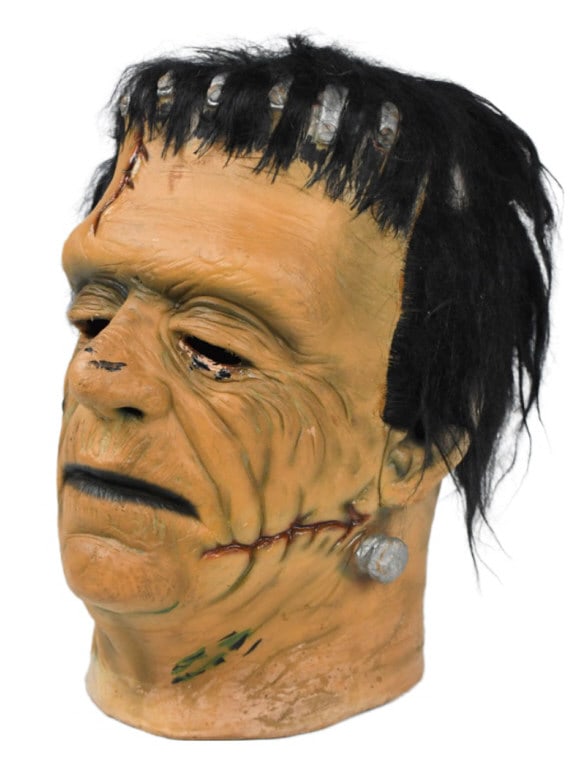 Don Post Calendar Glenn Strange Frankenstein Mask: Universal Studios Monsters Don Post Calendar series Glenn Strange Frankenstein reissue rubber / latex mask. Appears to be in fair condition with discoloration, paint / hair loss, and other wear from a