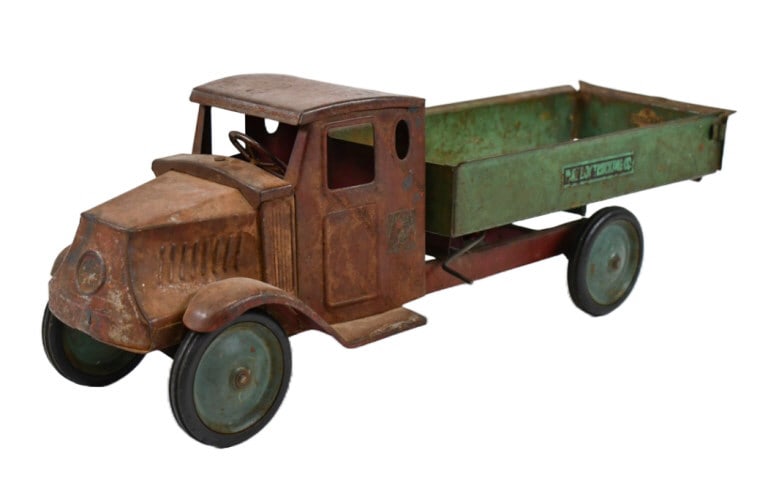 Original Steelcraft Mack Playboy Trucking Co Truck: Original Steelcraft Mack Jr. Playboy Trucking Co. dump truck. The truck displays very well with Mack Jr., Playboy Trucking Co., and Steelcraft decals. Original condition with discoloration, paint loss